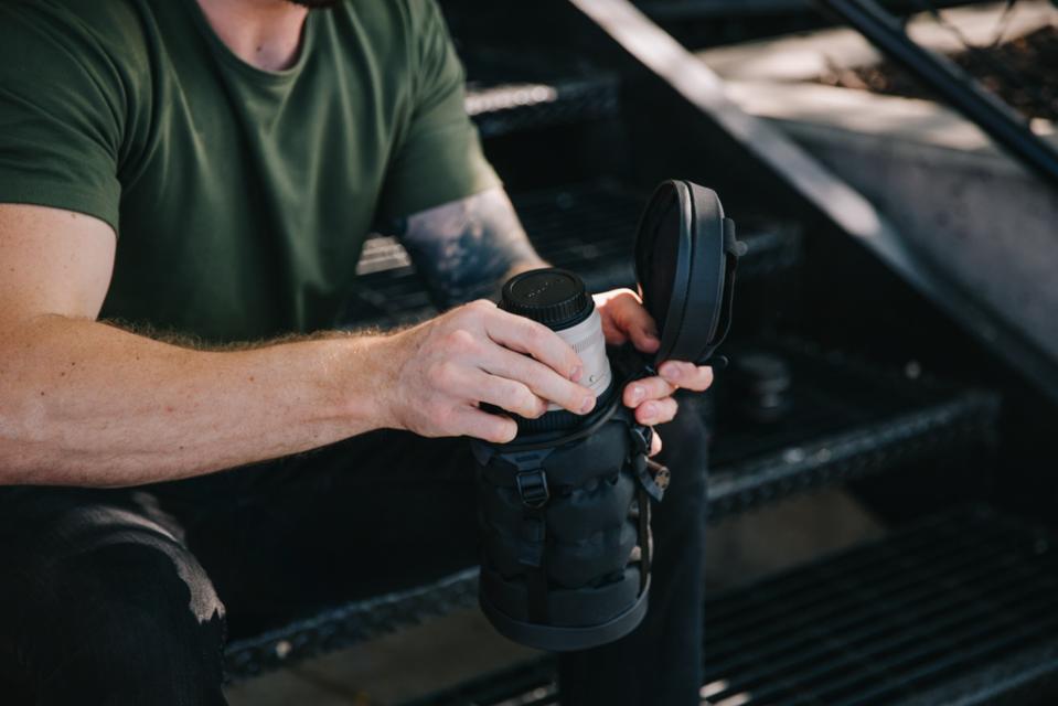 A man using the Wandrd inflatable case