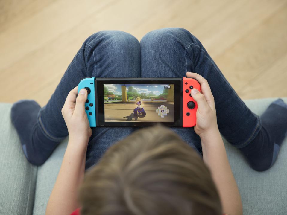 CHILD PLAYING VIDEO GAME