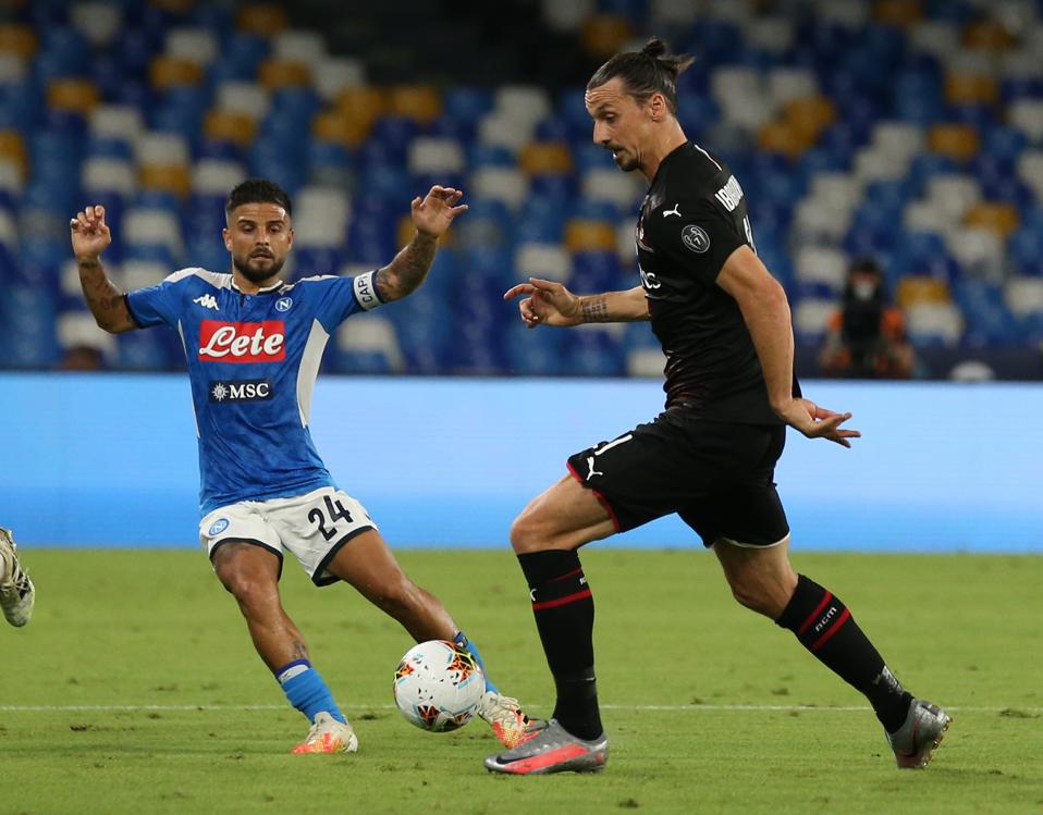 Milan's Swedish forward Zlatan Ibrahimovic fights for the...