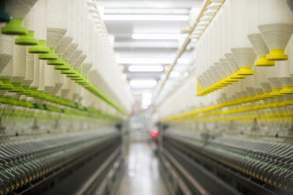 yarn spinning onto cones in textile factory