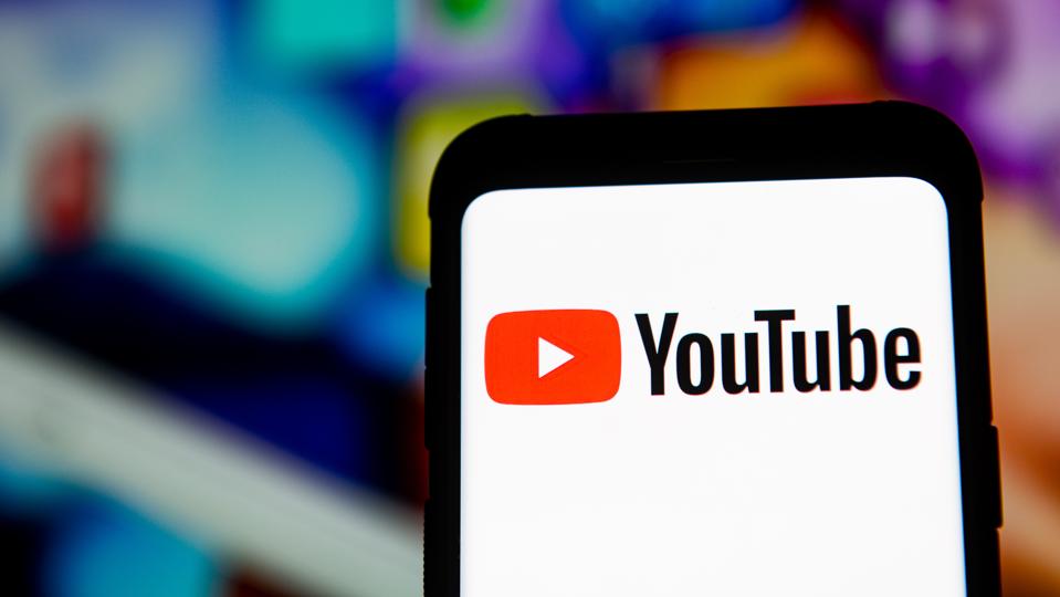 In this photo illustration a YouTube logo seen displayed on...