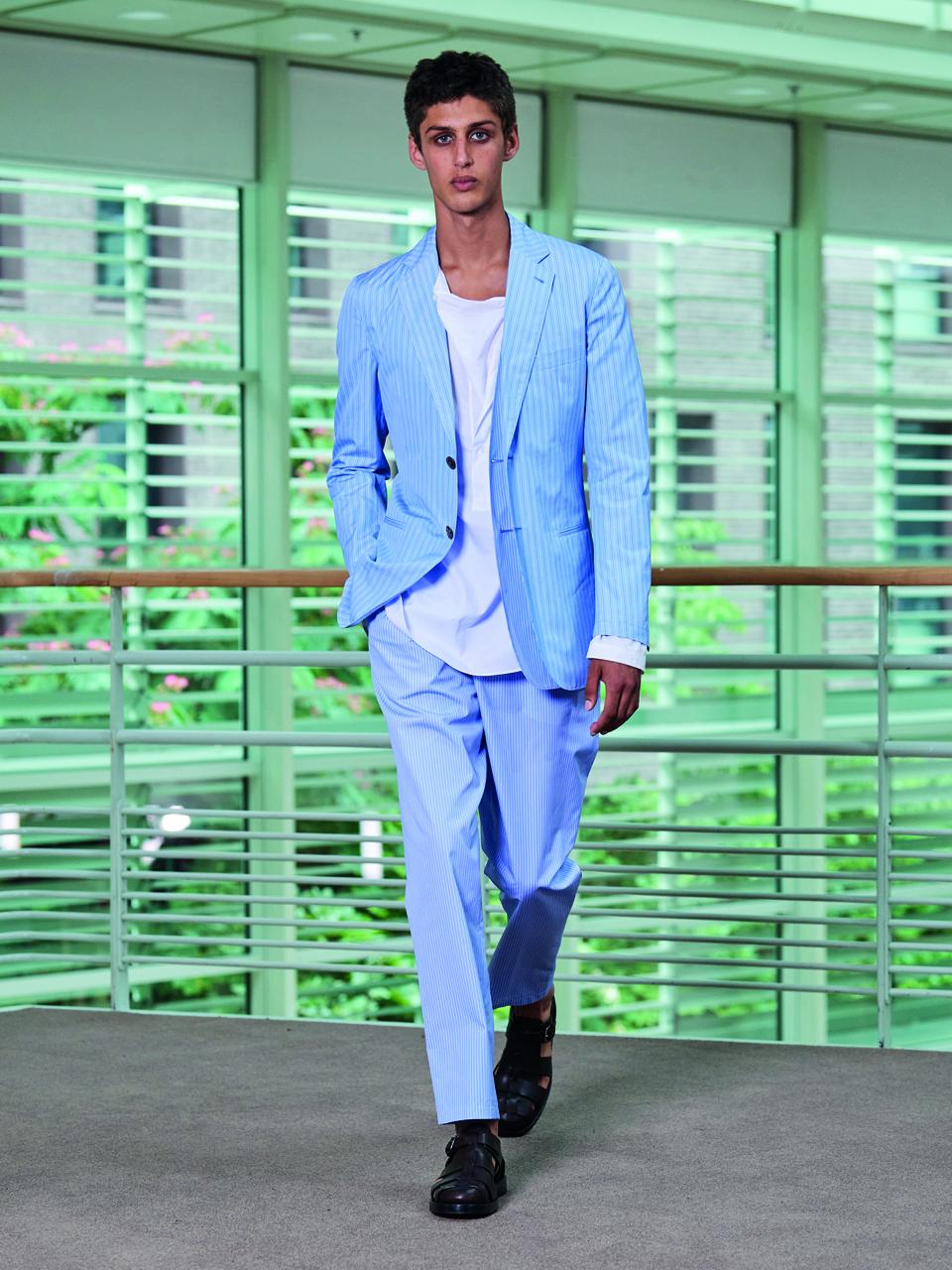 Single-breasted jacket with double front in blue cotton poplin with inlaid shirt stripes. Shirt with gusset collar in white cotton poplin. One-pleat trousers with elastic waist in blue striped cotton poplin. Sandals in chocolate calfskin. 8. Please see attached for the hi-res image