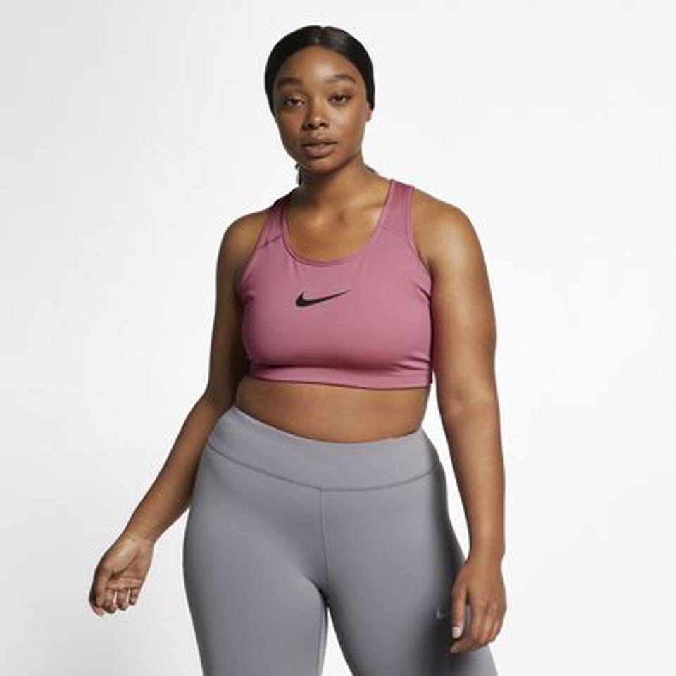 Nike Dri-FIT Swoosh Non-Padded Sports Bra in pink with black detail.