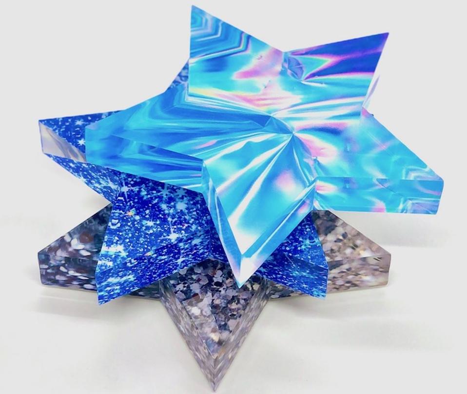 Star shaped blue and metallic paperweights