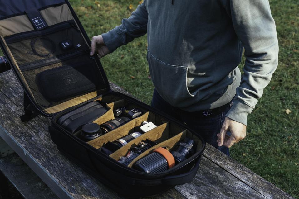 The Nomatic travel camera bag open on a table