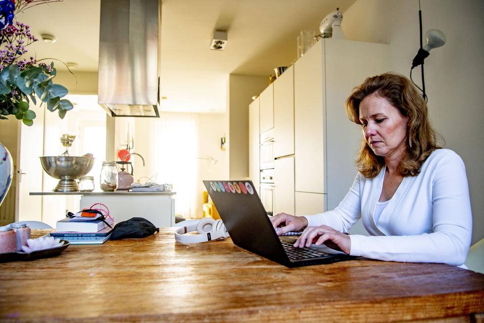 A woman working from home as a preventive measures against...