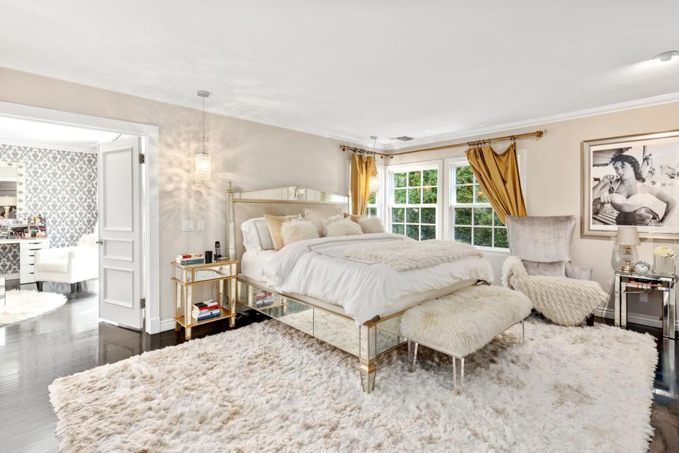 Shag carpeting lines the floor of a primary bedroom.