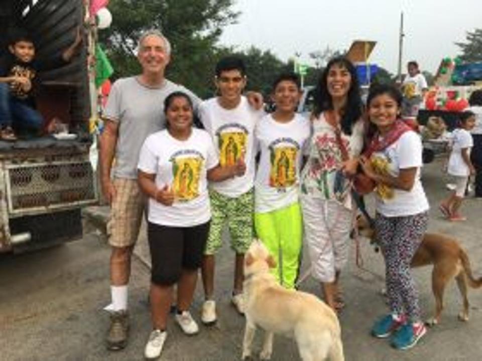 Jet Metier and Chuck Bolotin with Mexican children at Festival of the Virgin of Guadalupe