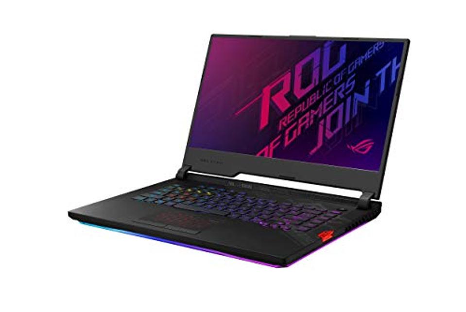 ASUS ROG Strix Scar 15 gaming laptop opened and showing Republic of Gamers wallpaper