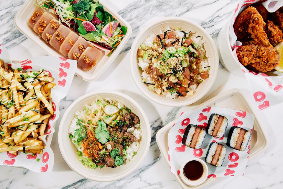 trays of takeout hawaiian and japanese food