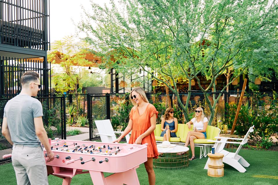 pink foosball table outdoors