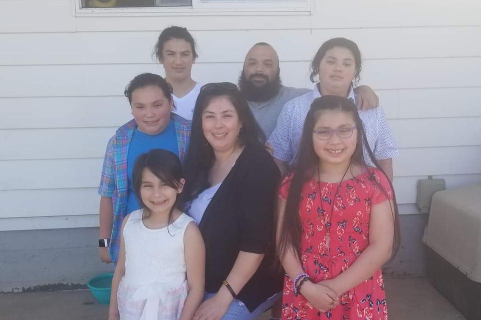 Neu domestic worker Suzi with her husband and five kids.