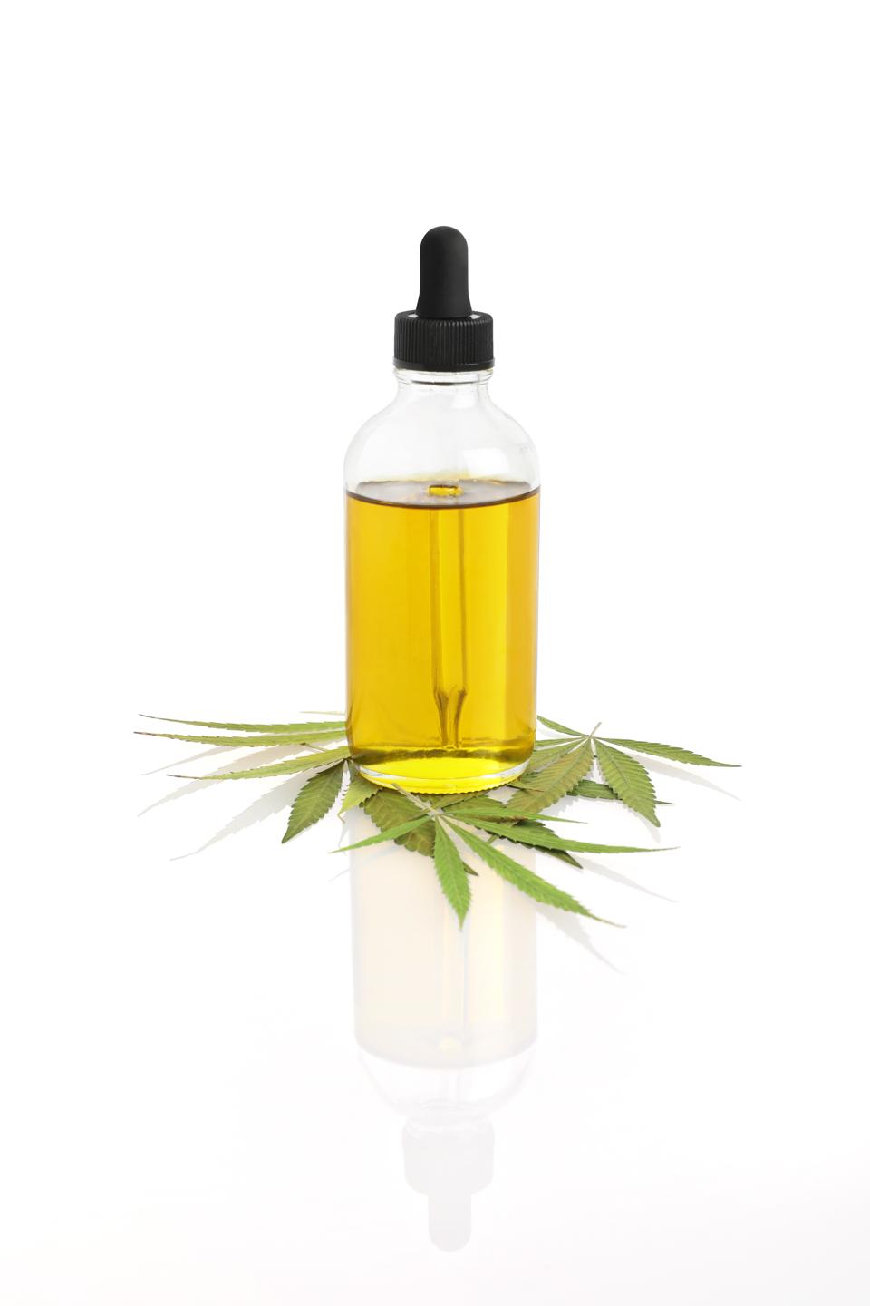 Bottle of CBD Oil with hemp leaf