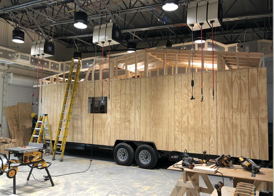 A work-in-progress tiny home, being built inside a warehouse at Valencia Collge’s Osceola, Fla., campus at the Construction Accelerated Skills Training Building.