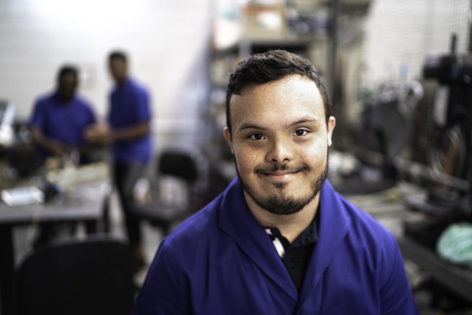 Portrait of special needs employee in industry