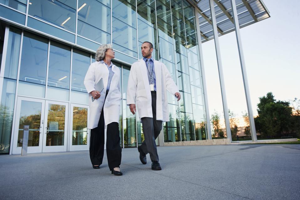 Doctors walking together outdoors