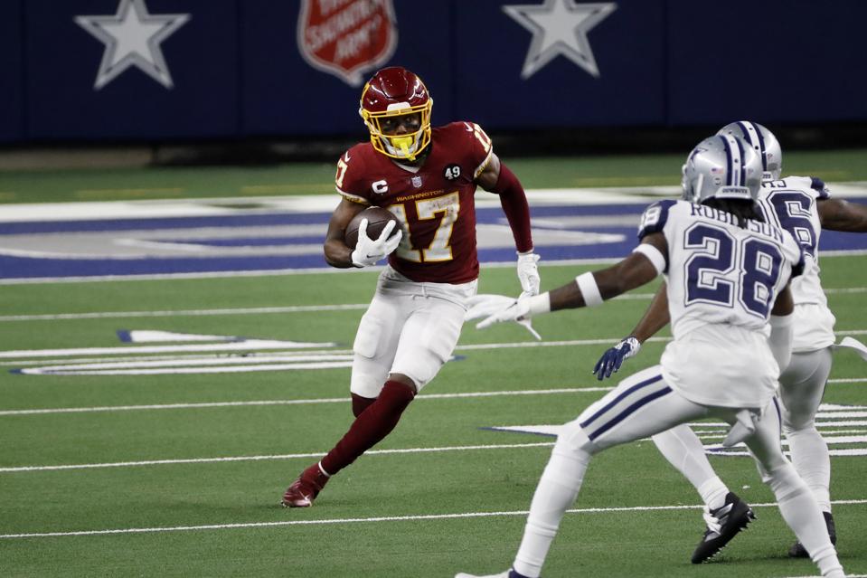 Washington Football Team wide receiver Terry McLaurin (17) advances the ball during the second half of an NFL football game against the Dallas Cowboys in Arlington, Texas, Thursday, Nov. 26, 2020. (AP Photo/Roger Steinman)