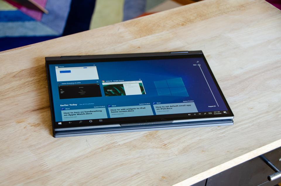 Lenovo Flex 5G laptop sitting on wooden table in tablet mode