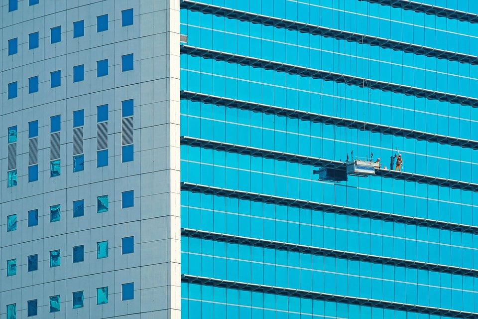 Window cleaners in tall building Jakarta.