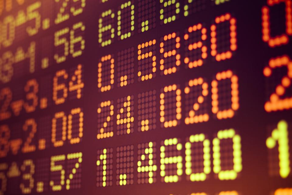 Close-up of digital board displaying stock data