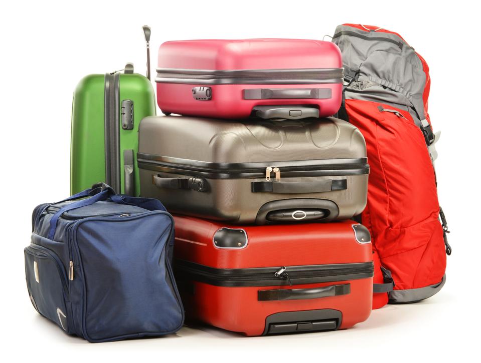 A bundle of colorful suitcases and bags