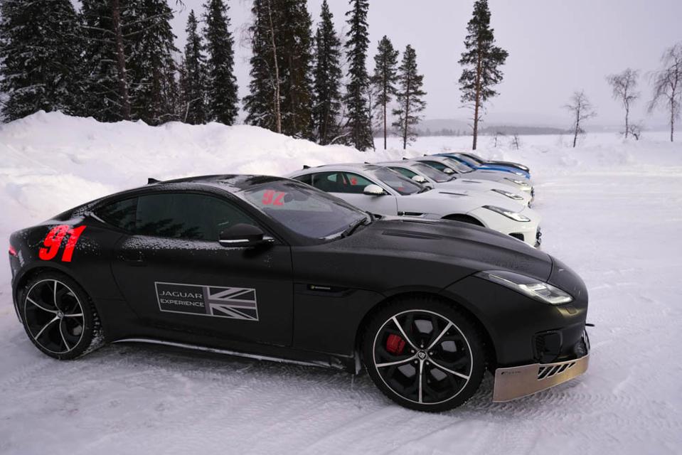 jaguar car lined up in snow