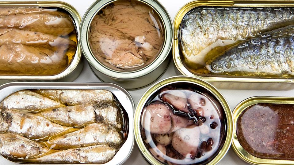 Tin cans full of seafood type foods like tuna and sardines