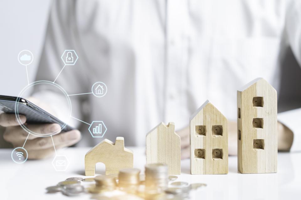 Concept of property mortgage and investment for a house background.