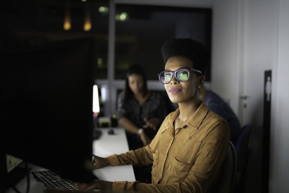 Portrait of businesswoman working late in the office