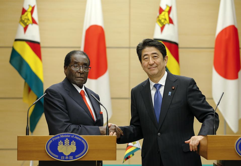 Zimbabwe's President Robert Mugabe (L) built a strong working relationship with Japan's Prime Minister Shinzo Abe. Seen here in Tokyo on March 28, 2016.