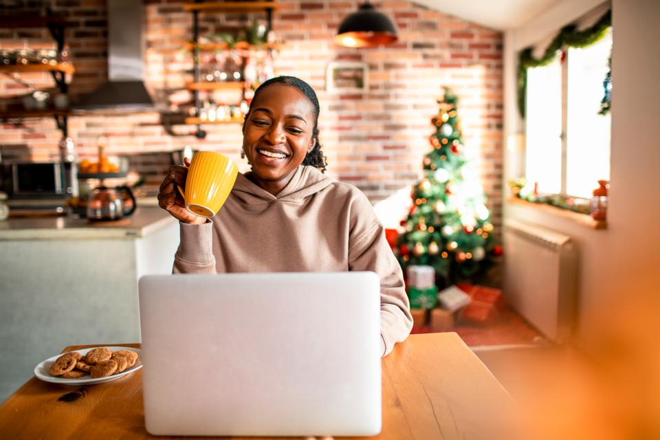 Young woman using a laptop during Christmas