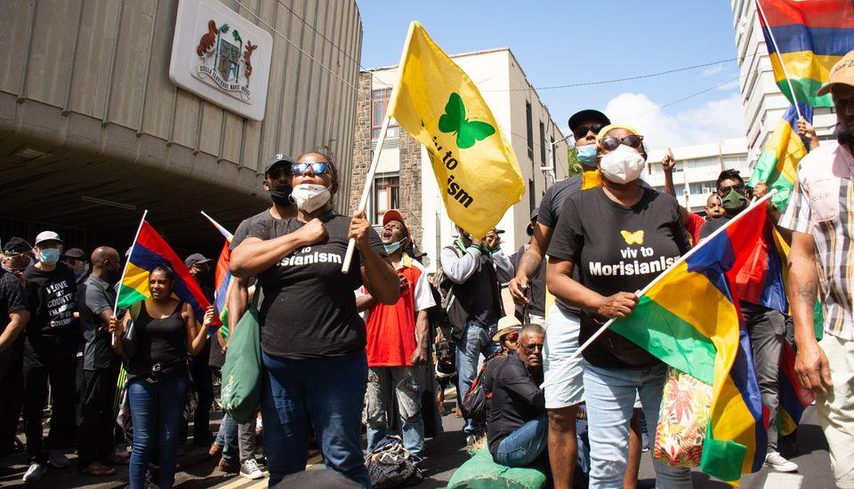 There have been protests outside Mauritius' parliament at how the oil spill response has been handled