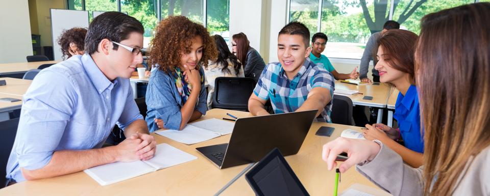 College study group brainstorming together in classroom or library