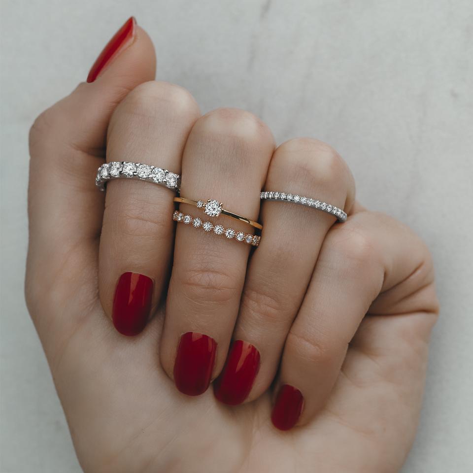14K gold stacker ring featuring moissanite accent stones.