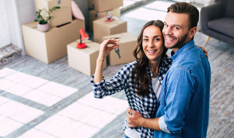 A young couple purchases new home.