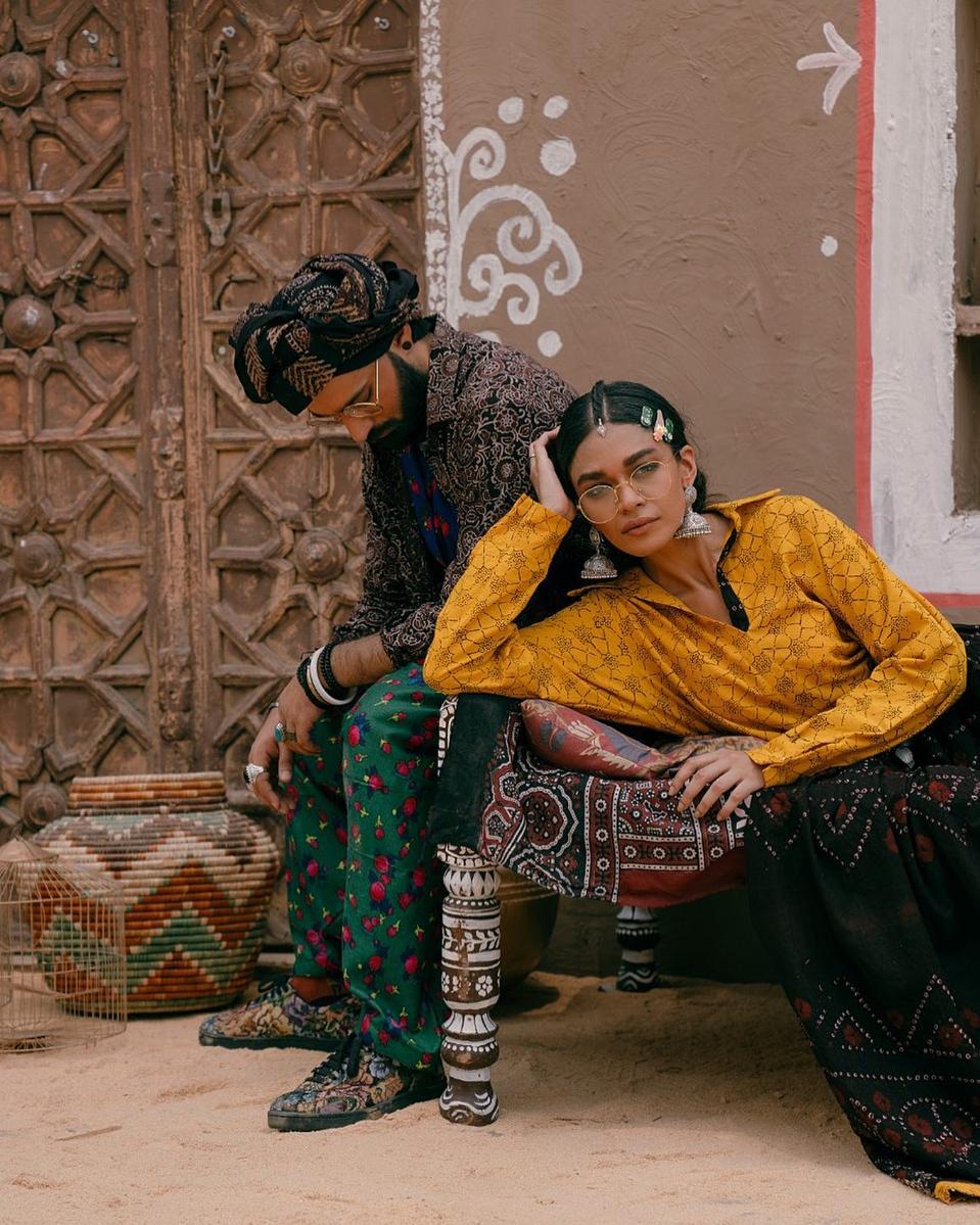 Models wear Aman Kay Rang ensembles.