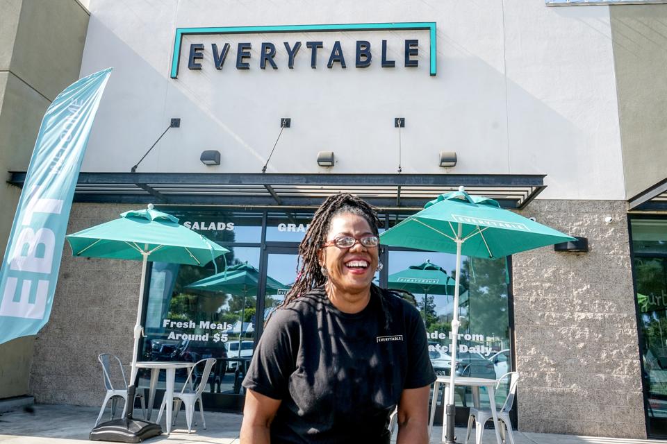 Dorcia Whitebrake in front of Everytable store