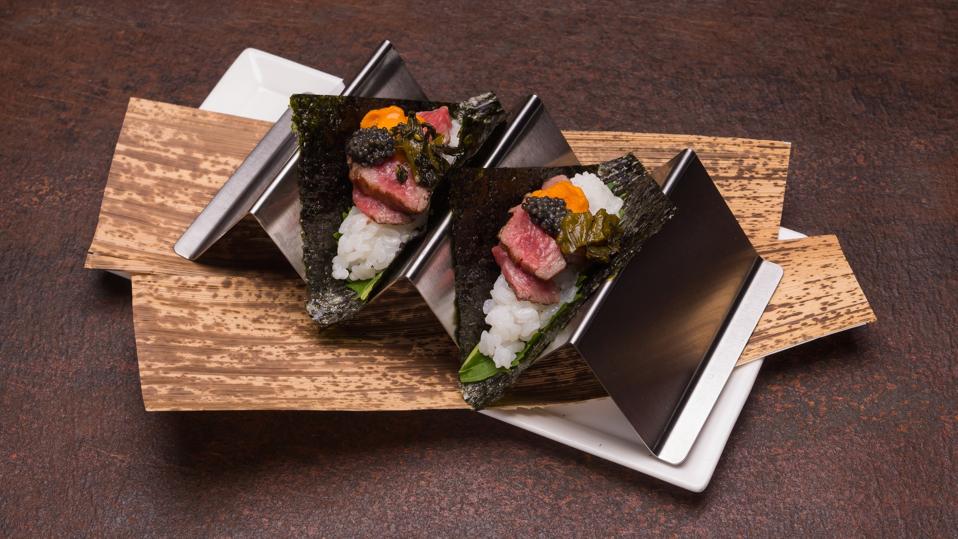 Wagyu hand rolls topped with uni and caviar