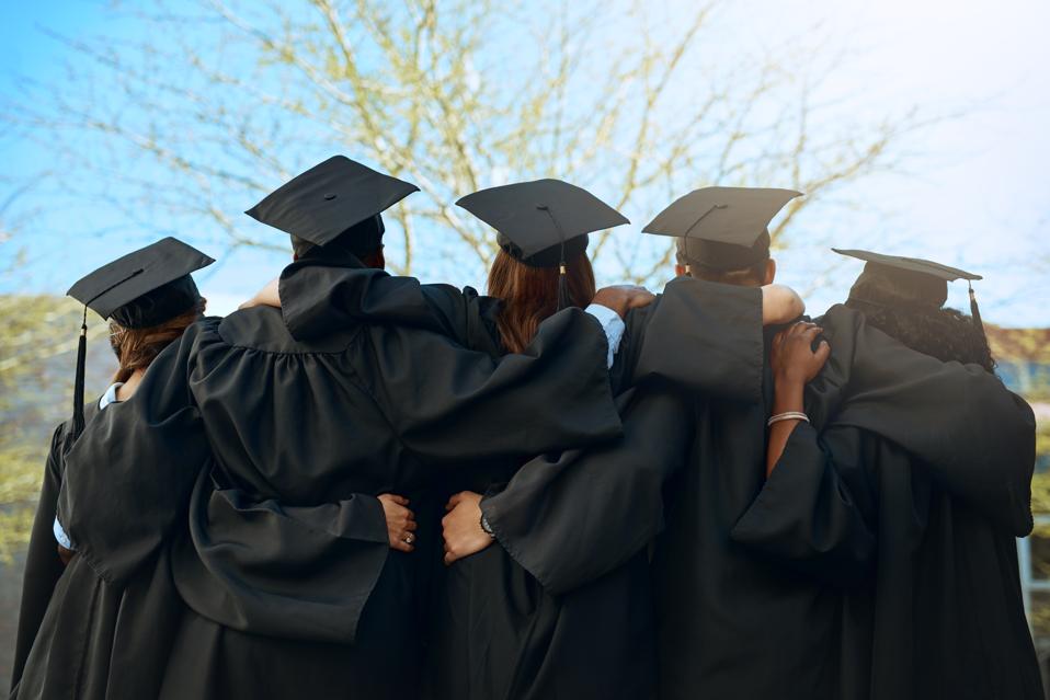 Graduates looking toward a bright horizon.