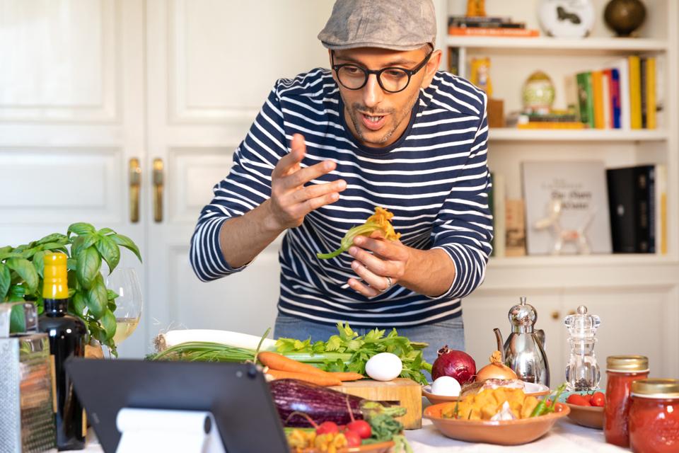 Happy man cooking lesson teaching online