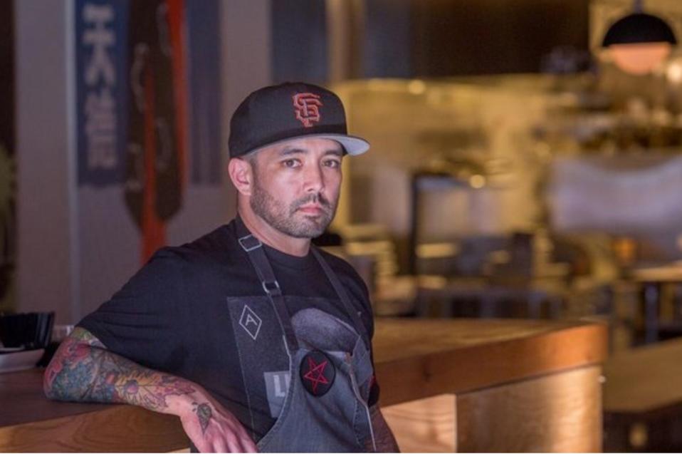 Richie Nakano in chef's apron and San Francisco Giants baseball cap