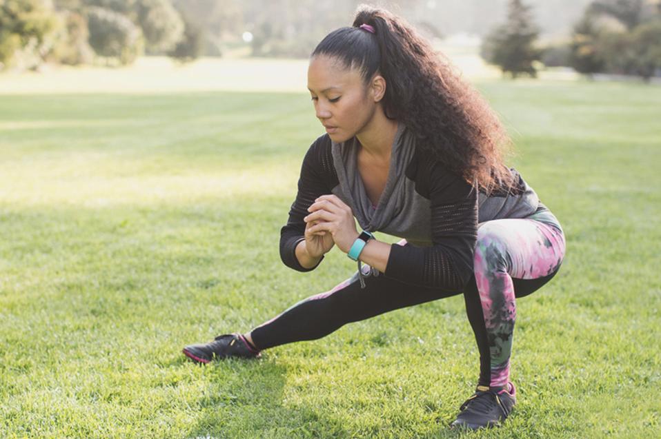 Woman exercising while wearing Fitbit