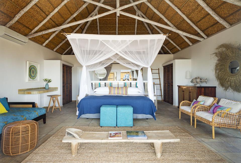The big rooms at Azura Marlin Beach in Mozambique have a colorful decor and African style