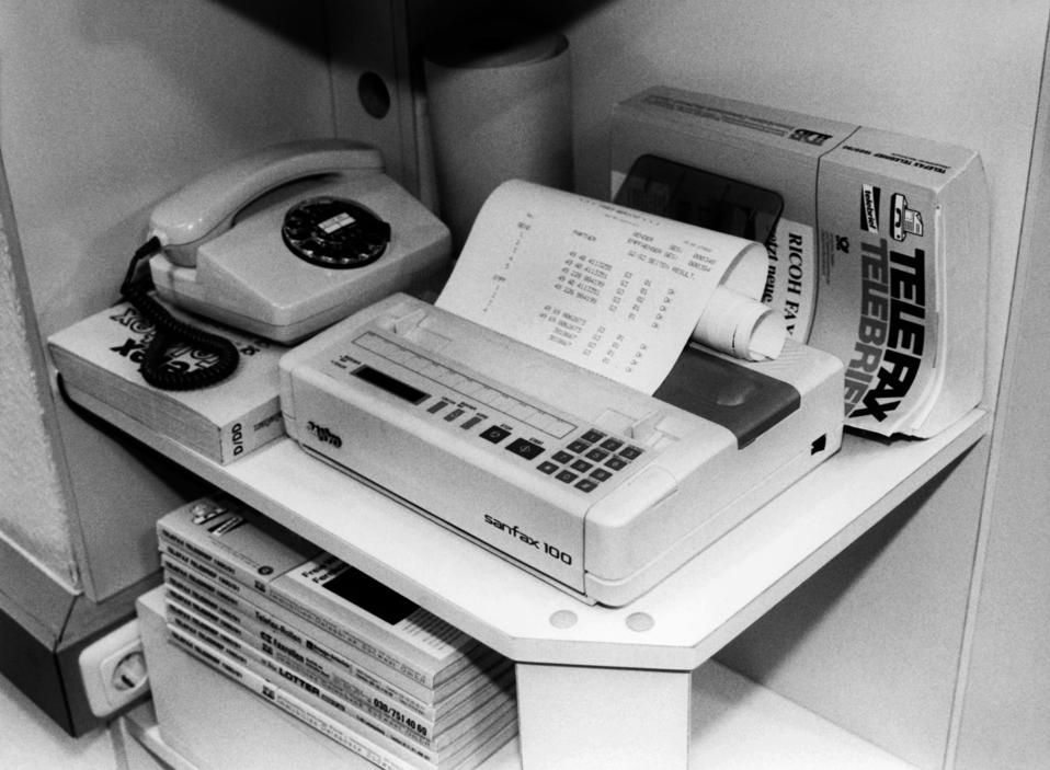 Black and white image of a fax machine in 1990.