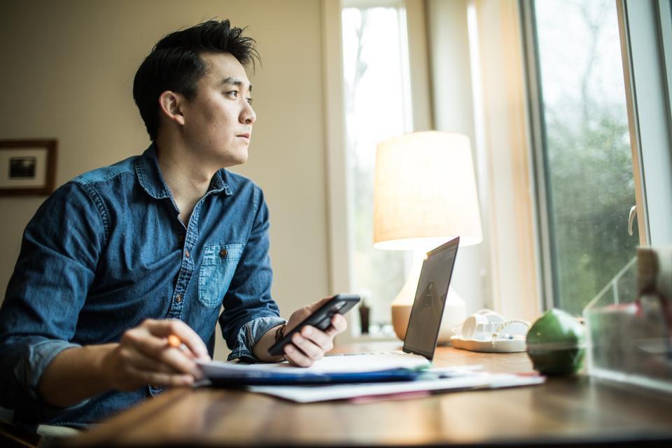 Man (early 30s) working in home office