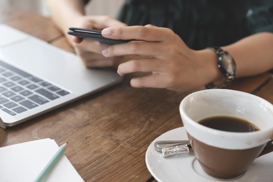 Close up of woman using mobile phone.