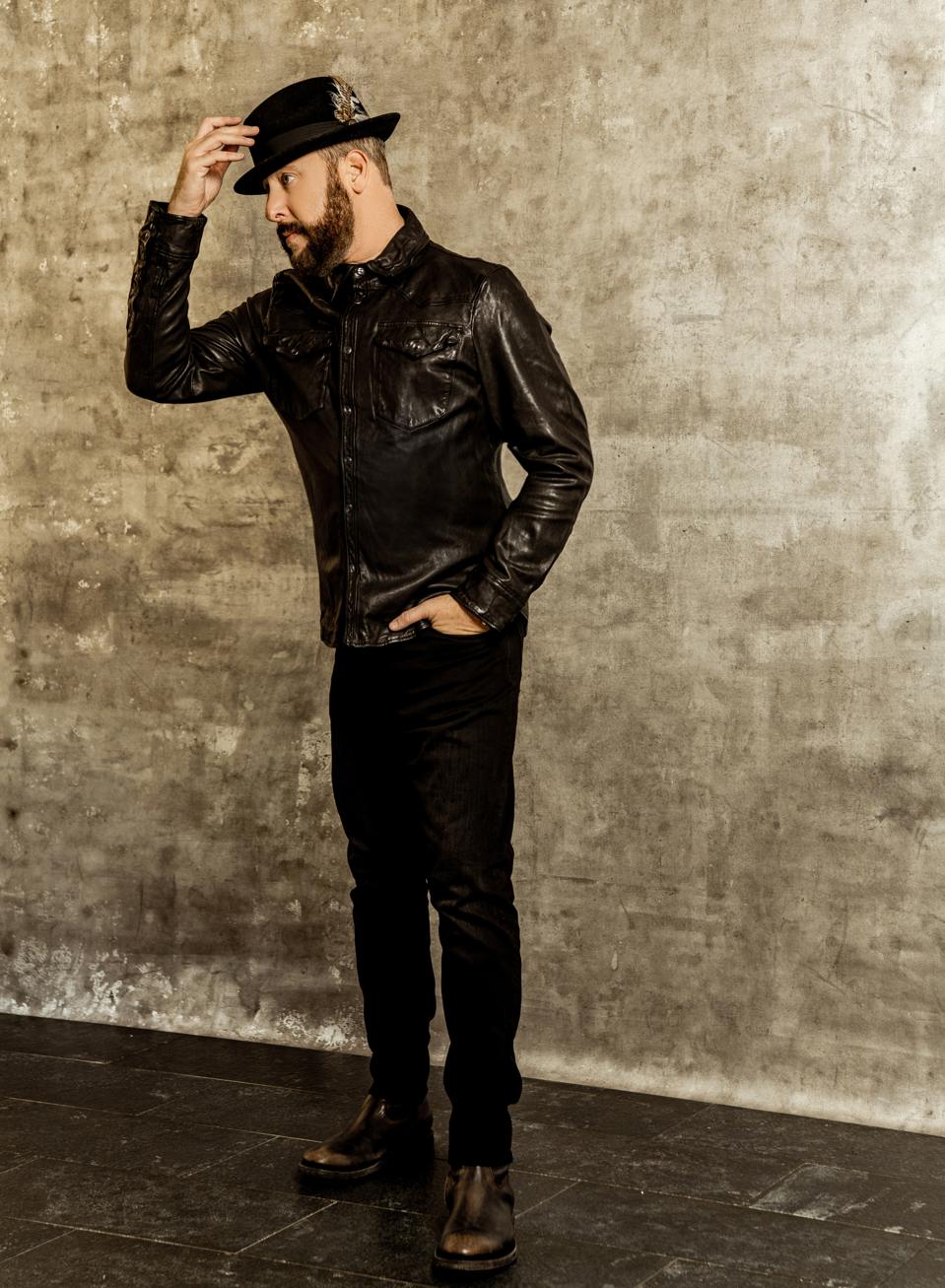 Brad Feinstein - CEO, Romulus Entertainment wears Black leather western shirt isRalph Lauren. Jeans RRL. Boots Frye, watch Rolex