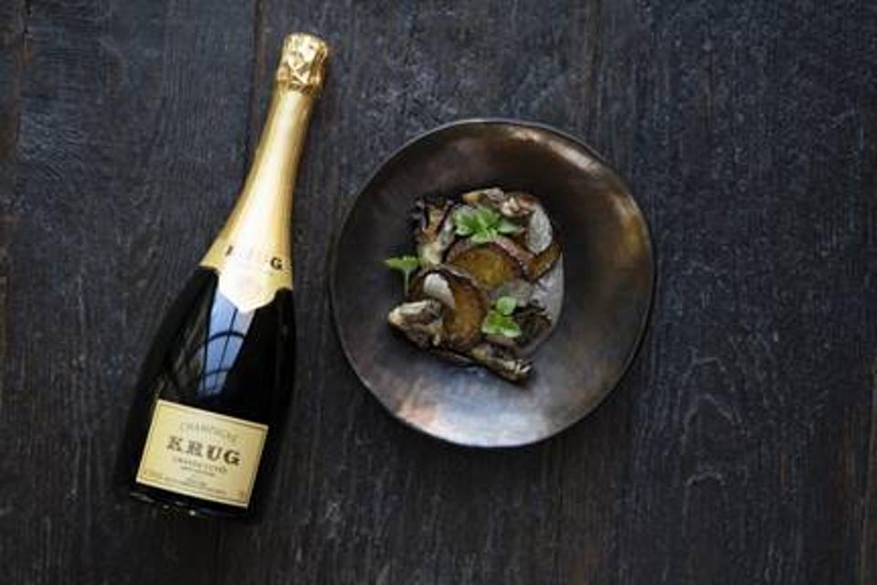 A bottle of Krug and the mushroom paired dish ready for holiday entertaining.