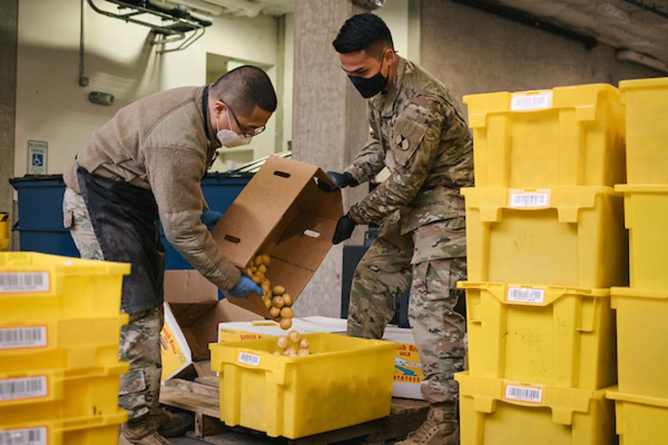 National Guard members help out at the University District Food Bank in Seattle.
