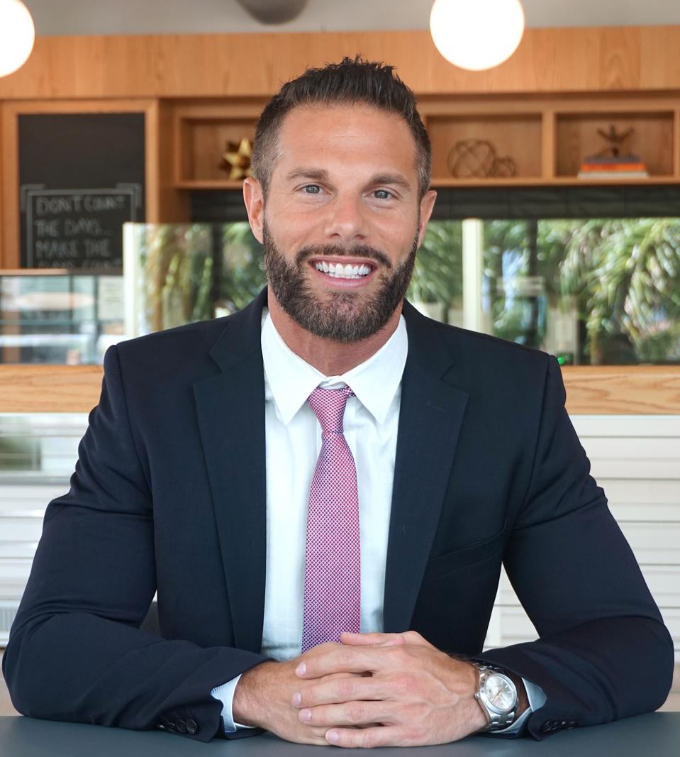 Lawyer Dustin Robinson poses for a headshot.